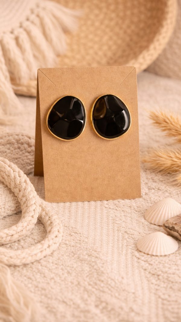 Zwart-gouden statement oorbellen studs