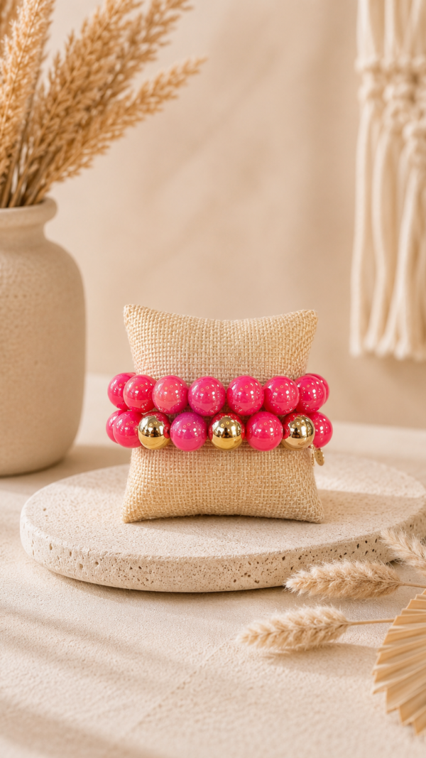 Fuchsia parelarmband met gouden accenten